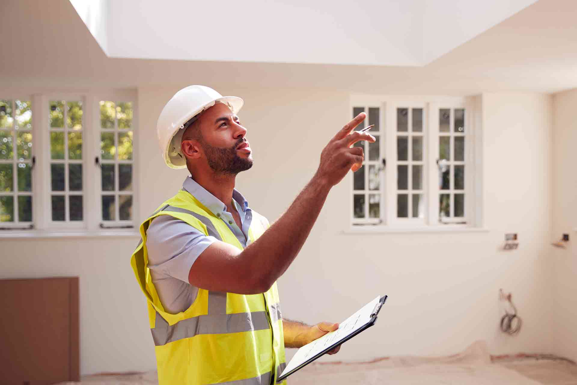 Third Party Wall Surveyors Sheffield reviewing plans between two parties during a dispute